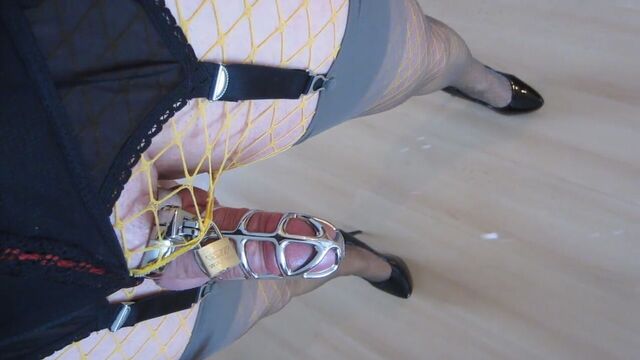 Walking in high heels with caged cum