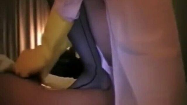 Asian Nurse in Yellow Rubber Gloves Gives a Handjob