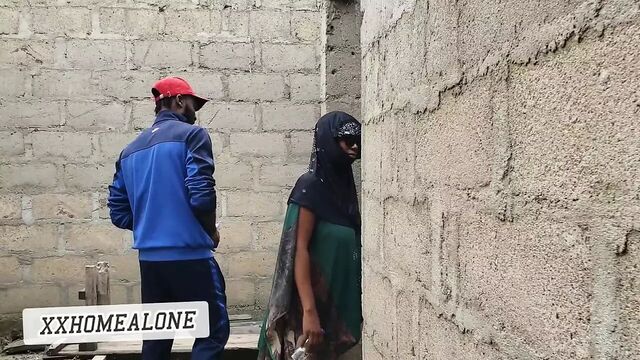 Big-titted Nigerian slut fucking in an uncompleted building.